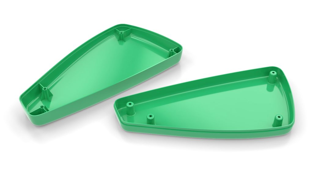 Image is of two 3D modelled parts that would ultimately fit together to make a single piece. They are separated to demonstrate the detailing on the internal areas of the parts. We can see the insides of both flat pieces which are both green in colour.