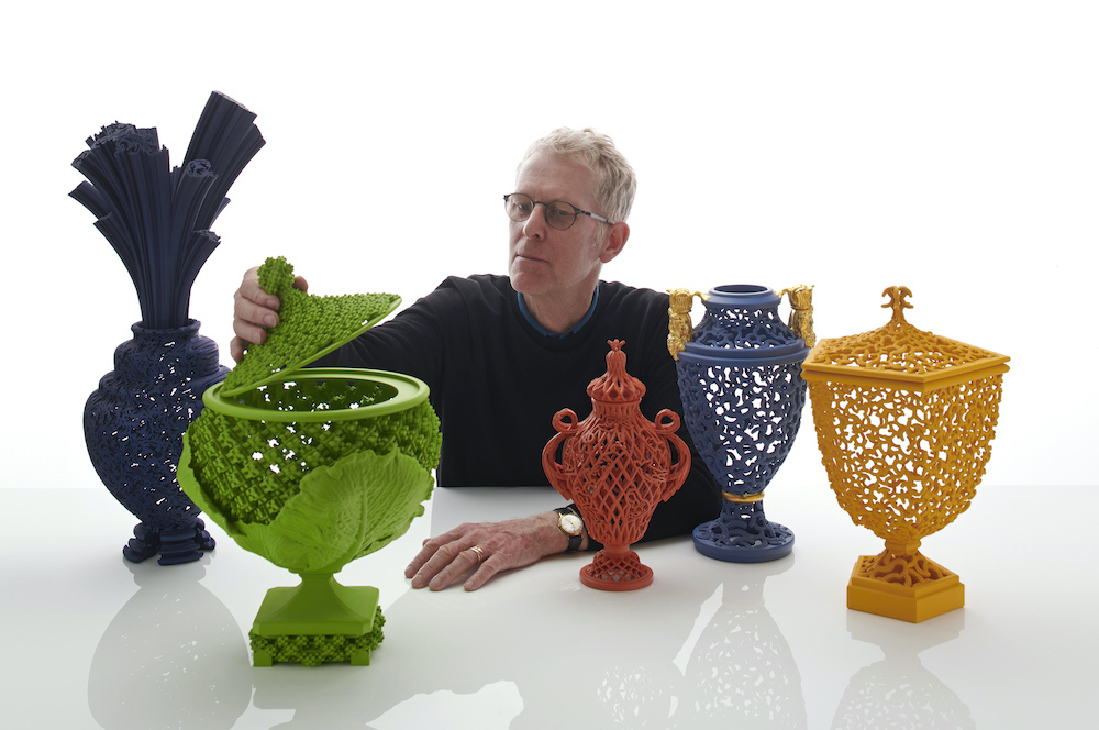 Photo of Michael Eden with some of his work.